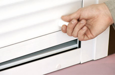 Spring-inertial mechanism for security shutters